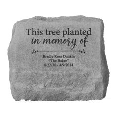 a memorial stone with the words, this tree planted in memory of bradley ross dunkin