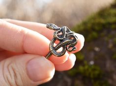 "Handmade sterling silver or bronze snake ring.  Dear customer, please keep in mind that bronze sometimes reacts with the skin and can leave a green \"mark\" under the ring. The good news - it is completely harmless and washable. In ancient times the Snake was worshiped as a dainty of house warm, giver of happiness, health, and well-being. As snakes change their skin, they are also considered a symbol of transformation, rebirth, and healing. PRODUCT DETAILS - Max. height: 21 mm/ 0.83\" - Width o Bronze Snake-shaped Jewelry Gift, Bronze Snake Shape Jewelry As Gift, Bronze Snake-shaped Jewelry For Gift, Antique Snake Ring As Gift, Unique Hand Cast Snake Ring As Gift, Unique Hand Forged Snake Ring, Unique Hand Cast Snake Ring Gift, Unique Hand Forged Snake Ring As Gift, Adjustable Engraved Snake Ring Gift