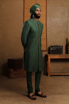 Royal green silk floral embroidered sherwani. Comes with kurta, churidar and dupatta.
Component: 4
Pattern: Embroidery
Type Of Work: Floral
Neckline: Band
Sleeve Type: Full
Fabric: Silk
Color: Green
Other Details: 
Concealed placket
Side slits
Note: Safa worn by the model is not for sale
Occasion: Groom - Aza Fashions Designer Green Salwar Kameez With Naqshi, Semi-stitched Green Anarkali Set With Naqshi, Festive Green Anarkali Set With Naqshi Detail, Eid Green Anarkali Set With Naqshi Detailing, Festive Green Anarkali Set With Naqshi, Green Naqshi Anarkali Set For Eid, Formal Green Anarkali Set With Dabka Embroidery, Unstitched Green Anarkali Set For Formal Occasions, Formal Green Anarkali Set With Dabka Detailing