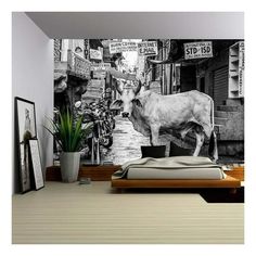 a black and white photo of a cow in a bedroom