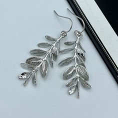 Elegant Silver Leaf Branch Earrings, an embodiment of natural beauty and sophistication. These earrings are meticulously crafted from high-quality sterling silver, creating a piece of jewelry that merges grace with durability. Inspired by the serene beauty of nature, our Leaf Branch Earrings feature an intricate leaf and branch design, lending a unique touch to your accessory collection. Their delicate and organic shape beautifully symbolizes growth and strength, making them not only a fashion statement but also a meaningful gift. Measurements: The total length from the top of the hook to bottom - 1.96 inches (50 mm) approximately. Branch: 37 mm x 14 mm Perfect for day-to-night wear, these earrings can enhance any outfit, whether it's a casual day at work or an evening soiree. Their lightw Silver Drop Earrings With Nature-inspired Style, Silver Nature-inspired Drop Earrings, Nature-inspired Silver Drop Earrings, Nature-inspired Drop Earrings With Lever Back Ear Wires, Nature-inspired Earrings For Anniversary, Green Wedding Jewelry, Purple Statement Earrings, Red Statement Earrings, Lavender Jewellery