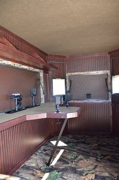 the inside of a trailer with two mirrors and lights on each side of the room