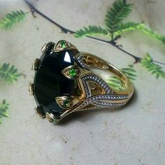 Like New. The Power Ring Fit For A Queen. Gold Over 925 Silver With Genuine Black Spinel And Vivid, Crisp Green Russian Diopside. Let This Be The Ring You Reach For Whenever You Need To Make A Statement Or Just Be Heard. Invest In Quality Jewelry That You Will Have Forever. Be Proud To Wear Or Give As A Gift. Be The Queen Who Gets This One. Truly Stunning And Beautiful From All Angles. Firm. Firm. Firm. Firm. Luxury Tsavorite Jewelry With Gemstone Accents, Elegant Tourmaline Cabochon Jewelry, Elegant Tsavorite Rings With Polished Finish, Elegant Tourmaline Jewelry With Accent Stones, Luxury Tourmaline Jewelry For Formal Occasions, Goth Ring, Power Ring, Black Spinel, Emerald Stone