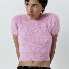 Fuzzy Cropped Top With Embellished Detail. Winter Pink Sequined Tops, Winter Party Tops With Short Sleeves, Pink Sequined Tops For Winter, Pink Fitted Tops With Rhinestones, Fitted Pink Tops With Rhinestones, Glamorous Embellished Crew Neck Tops, Feminine Crew Neck Party Tops, Fitted Embellished Pink Tops, Glamorous Embellished Top For Winter