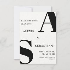 an elegant black and white save the date card with the letter s on it's front