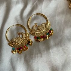 Multicolor Morni (Peacock) Hoop Earrings Color: Mainly Gold With Multicolor Beads Condition: New Comes As Shown In The Picture Multicolor Peacock Design Earrings For Festivals, Multicolor Peacock Design Earrings For Party, Multicolor Peacock Chandbali Earrings, Multicolor Chandbali Earrings With Peacock Design, Multicolor Peacock Design Chandbali Earrings, Peacock Colored Earrings For Wedding, Multicolor Chandbalis For Pierced Ears, Gold Peacock Design Earrings For Party, Gold Peacock Design Danglers For Party