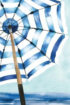 an open umbrella sitting on top of a wooden pole next to the ocean in blue and white