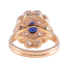 This is part of Chairish’s Fine Jewelry assortment.  Estate 18K oval sapphire VS Diamond Ring. This 18 karat yellow gold ring features a 0.90 carat oval sapphire and 0.85 carat total weight diamonds with 20 round diamonds VS clarity, G-H color. The sapphire measures 7mm x 5mm and is a fine medium blue. This custom made ring is a size 6.75, weighs 6.15 grams total weight and is appraised at $4975. [ADTI 1394]  Metal: 18k Gold,Yellow Gold  Stone: Diamond,Sapphire  Stone Cut: Oval Cut Tiny White Flowers, Resize Ring, Vs Diamond, Blue Zircon, Sapphire Stone, Yellow Gold Ring, Stone Cuts, Yellow Gold Rings, 21st Century