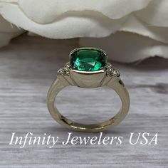 "The ring pictured is lab created emerald and moissanite #6902 Rose Gold is available upon request as a custom order and is a final sale (non refunable, non returnable, non exchangeable). Emerald is the Birthstone for May -Approximate total carat weight: 2.52ctw. diamond equivalent -Center Stone Size: approx. 2.40ct. diamond equivalent -Gem Type: Lab created emerald -Center Stone Shape: cushion cut 8x8mm -Center Stone Color: green, nicest color in emeralds -Center Stone Clarity: VS2 or better -M Gia Certified Cushion Cut Emerald Ring For Anniversary, Gia Certified Cushion Cut Emerald Anniversary Ring, Classic Moissanite Emerald Ring For May Birthstone, Gia Certified Emerald Ring For Anniversary, May Birthstone, Gia Certified Emerald Anniversary Ring May Birthstone, Moissanite Emerald Ring For Anniversary, May Birthstone, Emerald Moissanite Ring For Anniversary, May Birthstone, Moissanite Emerald Ring For Anniversary, Heirloom Green Diamond Ring With Bezel Setting