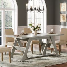 a dining room table with chairs around it