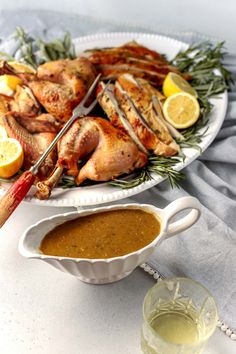 a platter filled with chicken and dipping sauce