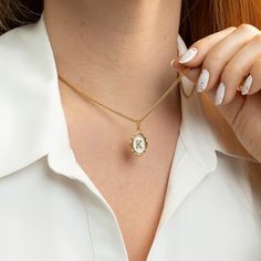 "Oval Initial Necklace  Always carry your loved ones close to your heart ♡ * High-Quality 316L Stainless Steel * Gold Our Products are different from regular gold plating because it is a THICK layer (x10 times more) of 18k solid gold on stainless steel, making it more durable. Size Specs: * Initial Pendant Dimensions: 11mm x 14mm * Necklace will come with a 2\" extension chain so you can FINE TUNE the fit. If you don't want, please contact us. Features: * Waterproof / Hypoallergenic / 100% lead Personalized Oval Gold Necklaces, Personalized Gold Oval Necklace, Personalized Oval Gold Necklace, Initial Pendant Necklace For Keepsake, Personalized Gold Locket Necklace For Mom, White Locket Jewelry For Personalized Gifts, Personalized White Locket Jewelry, White Initial Pendant Jewelry For Valentine's Day, Oval Charm Necklaces For Gifts