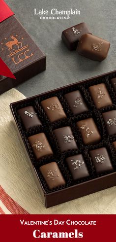 valentine's day chocolates for him in a gift box on a table with red ribbon