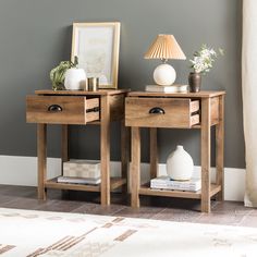 two wooden tables sitting next to each other on top of a carpeted floor in front of a gray wall