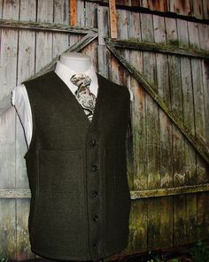 "Goodmorning! vintage rare trad heavy virgin wool tweed green  army green tactical vest  waistcoat. The vest waistcoat features  five-button front closure, two front chest pocket. Left pocket  has multiple tactical pocket as well as slant hip pockets . This vest is a great find for ardent vintage enthusiast with taste and style. Estimated size: 46  : Please see measurement below , for best fit compare measurement with similar vest waistcoat or item. Armpit to Armpit: 24\" Front Length: 26\" Cond Military Style Khaki Vest For Winter, Military Style Winter Workwear Vest, Winter Military Work Vest, Classic Green Vest For Winter, Classic Green Winter Vest, Green Winter Vest With Buttons, Green Waistcoat, Vest Waistcoat, Tactical Vest