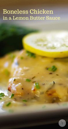 a white plate topped with chicken covered in lemon butter sauce