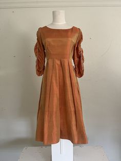 "Divine for autumn. This burnt orange dupioni silk has a superb fit with amazing sleeves. Ruched sleeves with assorted clear, pink and gold beadwork. Perfect pleats. Zipper hidden on back. Interior label, Dorothy Egan original. Best fit for a US medium/large.  Measurements 36\" chest 34\" waist 46\" hips 17.5\" sleeve 16\" shoulders  40\" total length" Orange Clothes, Orange Outfits, Burnt Orange Dress, Orange Outfit, Dupioni Silk, Orange Dress, Dress Clothes For Women, Burnt Orange, Pink And Gold