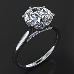 a diamond engagement ring on a black background