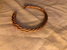 A braided copper bracelet made from 4 strands of copper wire then shaped to form. 4 Braids, Doll Jewelry, Copper Bracelet, Copper Wire, Bracelet Making, Wire Wrapped, Doll Toys, Doll Clothes, Braids