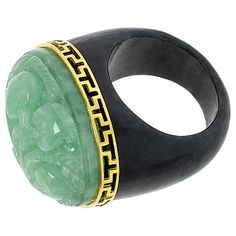 Elevate your ensemble with the Kwan Collections Gold-Plated Floral Carved Jade Ring. This exquisite piece showcases a masterful blend of artistry and elegance, perfect for those who appreciate unique jewelry.

- Size: 7
- Color: Gold
- Material: Yellow gold-plated sterling silver
- Gender: Female
- Features an oval-shaped green jade, intricately carved with a floral design, set atop a charcoal jade base
- Dimensions of the ring top: Approx. 3/4"L x 1"W x 9/16"H; Shank width: 5/16"W
- Design deta Luxury Carved Jewelry For Formal Occasions, Collectible Art Deco Carved Jewelry, Art Deco Carved Collectible Jewelry, Luxury Green Intaglio Rings, Luxury Ceremonial Gemstone Jewelry, Luxury Carved Rings, Elegant Carved Oval Jewelry, Elegant Oval Carved Jewelry, Luxury Carved Jewelry For Weddings