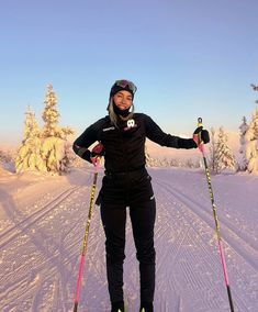 a woman standing on skis in the snow