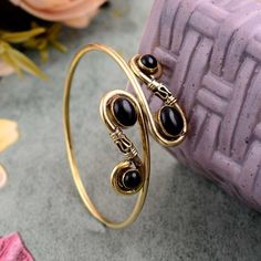 "Natural Black Obsidian Bangle , Gemstone Bangle , Ethnic Cuff Bracelet , Adjustable Bangle , Gold Plated Jewelry ❥ Customers satisfaction is our biggest priority, please contact us with any questions/queries for future or existing orders, and we will do our best to make sure you are happy with your order. ❥Please make sure to add the correct address during check out. You can return your purchased item within 15 days after successful delivery. We offer a 100% \"Money Back Guarantee\" if you are not satisfied with your purchase. Return charges will be paid by buyers only! ❥ Please share your numbers (in personalization box ) as required for shipping address details, and it'll help us to contact you easily. And don't worry about the privacy, we'll keep it safe with us, So try to cooperate wi Bohemian Black Bangle As Gift, Black Metal Bohemian Cuff Bracelet, Black Bohemian Bangle Jewelry, Bohemian Black Metal Cuff Bracelet, Bohemian Black Bangle Jewelry, Handmade Black Bohemian Bangle, Bohemian Metal Cuff Bracelet With Natural Stones, Upper Arm Cuff Bracelet, Gold Arm Cuff