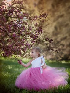 "One shoulder tutu dress in the color combo of your choice! It's pictured in DUSTY ROSE with a WHITE SATIN bodice. The top of the dress is FULLY LINED and the top of the strap opens to tie with a ribbon strap that ties at the right shoulder (not at the left shoulder as pictured). The back of the dress is stretchy elastic along the top hem. We can make this dress in literally any color skirt (or even a mixture of colors). Convo us for questions. WANT A SEWN IN SLIP TO LINE THE TUTU? https://www.e Cute White Tulle Skirt Dress, Summer Princess Tutu Dress For Pageants, Princess Style Tutu Dress For Summer Pageant, Princess Style Summer Tutu Dress For Pageant, Spring Dress-up Tutu Dress With Tulle Skirt, Summer Pageant Princess Dress With Tulle Skirt, Spring Dress-up Tutu Dress, Cute Summer Pageant Tutu Dress, Pink Tutu Dress With Tulle Skirt For Pageants