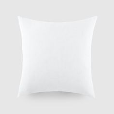 a white pillow on a gray background