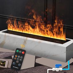 a remote control sitting in front of a fire