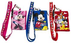 three disney mouse purses are lined up in different colors and designs, one is pink, the other is blue