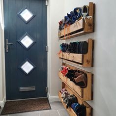 there is a blue door and some shoes on the shelves in front of the door