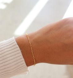 One of our favorite chains; now offered as a bracelet! MEASUREMENTS Bracelet Sizing: XS=5.5", S=6", M=6.5", L=7", XL=7.5"Offered in 14k Gold Fill or sterling silver To measure your wrist size, wrap a piece of string around your wrist the way you would like the bracelet to fit. Then lay the string flat and measure the inches to get your size. Minimalist 14k Gold Oval Link Bracelets, Minimalist 14k Gold Oval Link Bracelet, Minimalist 14k Gold Bracelet, Dainty 14k Gold Chain Bracelet, Everyday 14k Gold Satellite Chain Bracelet, Minimalist 14k Gold Everyday Bracelets, Minimalist 14k Gold Bracelet With Delicate Chain, Modern Everyday 14k Gold Filled Bracelet, Minimalist Tarnish-resistant Gold Bracelet With Rectangular Links