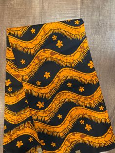 This  African Fabric is high quality African print made from 100% cotton and it's 45 inches wide. It is used for making African Clothing, African quilts, & For Home decoration. FYI: Print is Double sided. The listing is for 1, 6 yards and Headwrap Each piece of fabric measures:  36in by 45in for 1 yard 216in by 45in for 6 yards 70in by 22in for Head wrap If you purchase more than one yard, you will receive one continuous piece. *If you require more than what I have listed, feel free to send me e Traditional Black Fabric With Block Print, Traditional Black Block Print Fabric, Black Fabric With Traditional Patterns, Traditional Brown Ankara Fabric, Traditional Black Fabric With Traditional Patterns, Brown Ankara Fabric With Batik Print, Orange Ankara Fabric With Batik Print, Printed Orange Ankara Fabric, Traditional Ankara Fabric With Batik Print