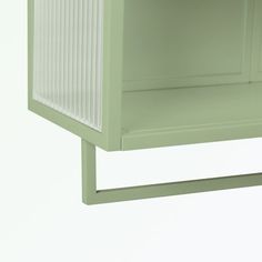 a green shelf with white stripes on the top and bottom, against a white background