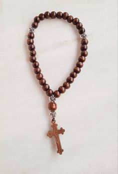 Wooden Christian 33 knot Prayer Rope / Car Pendant / Prayer Beads / komboloi 33 Wooden small Beads 1 Wooden big Bead Wooden Cross Jesus Christ crucifixion 4 Metalic Silver Beads with engraved Cross Elastic Cord Blessed on the lerics of Saints and Holy cross For bless, protection and prayer With myrrh/ anointing oil Prayer with rosary, which is very helpful in concentrating the mind and pray with says following greetings: Lord Jesus Christ have mercy on me Adjustable Beaded Rosary For Blessing, Adjustable Rosary With 108 Beads As Gift, Adjustable Hand-strung Rosary As Gift, Adjustable Bohemian Rosary Bracelet With Cross, Spiritual Rosary With Large Beads As Gift, Beaded Brown Rosary Gift, Adjustable Brown Rosary Bracelet For Meditation, Brown Beaded Rosary As Gift, Spiritual Brown Rosary Bracelet For Gift