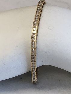 "14kt Yellow Gold Lady's Diamond Bracelet 7\" in length consisting of 3.30ct total weight full cut round brilliant white diamonds all channel set in solid heavy flexible mounting with a hidden box clasp and a fig 8 secure safety clasp closure. This Classic Style Bracelet is very flexible and comfortable to wear daily. This item would Retail for $7,350.00" Luxury Diamond Tennis Bracelet With Channel Set, Formal Diamond Tennis Bracelet Channel Set, Luxury Diamond Channel Set Tennis Bracelet, Channel Set Round Cut Diamond Bracelet, Luxury Channel Set Diamond Tennis Bracelet, Fine Jewelry Diamond White Diamond Bracelet With Channel Set, Diamond White Channel Set Diamond Bracelet, Fine Jewelry Diamond Bracelet With Channel Set, Fine Jewelry Cubic Zirconia Tennis Bracelet Channel Set