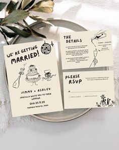 the wedding stationery is laid out on a plate