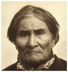 an old black and white photo of a native american man with wrinkles on his face