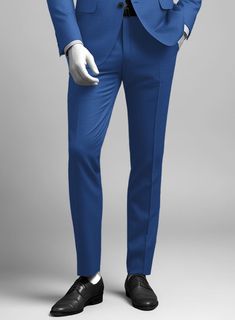 Seeking an ensemble that elevates your wardrobe to the next level? Introduce yourself to our Napolean Dodger Blue Wool Pants. Crafted from a luxurious wool blend, it features a discernible solid pattern immersed in a rich blue hue, exuding confidence and distinction. The texture ensures both a striking appearance and supreme comfort, making it an ideal choice for various occasions. Whether it's a business event or a significant celebration, these pants guarantee you'll make a memorable impression with unparalleled style.   Look Includes   Napolean Dodger Blue Wool Fabric  Cross Pocket  Flat Front  Two Welted Back Pockets on Trousers   Click 'Customize Now' to modify the look if needed.  Lining: Viscose, Dry Clean, Pants can be lightly washed. Blue Formal Trousers Suit, Tailored Blue Wool Dress Pants, Formal Slim Fit Blue Dress Pants, Formal Blue Slim Fit Dress Pants, Blue Slim Fit Dress Pants For Formal Occasions, Blue Straight-leg Elastane Dress Pants, Blue Semi-formal Straight Leg Suits, Elegant Blue Business Bottoms, Elegant Blue Bottoms For Semi-formal Events