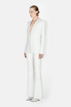 Tailor-made nuptials begin with the Sculpted Crepe blazer. Padded shoulders accentuate the hourglass shape for an empoweringly modern look. Pair with the matching trousers. Evening Pantsuit With Notch Lapel And Pressed Crease, Evening Tailored Pantsuit With Structured Boning, Chic Evening Suits With Pressed Crease, Formal Long Sleeve Pantsuit With Structured Boning, Tuxedo Blazer With Structured Boning, Party Blazer With Structured Shoulders And Notch Lapel, Formal Tuxedo-style Pantsuit With Structured Boning, Tuxedo Style Formal Pantsuit With Structured Boning, Elegant Structured Pantsuit For Party