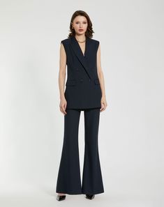 Our Classic Crepe Flared Trouser is a versatile wardrobe essential, combining timeless elegance with a retro flair. Pair them with a blouse for a polished professional ensemble, or dress them down with a casual top for a relaxed yet refined look. With their timeless appeal and comfortable fit, these trousers are sure to become a staple in your wardrobe rotation. Mac Duggal Crepe fabric (100% polyester) Fully lined High rise Front darts Inseam pockets Zip fly with concealed button closure Flare l Blouse And Trousers, Sleeveless Blazer Vest, Daytime Wedding, Sleeveless Blazer, Maxi Dresses Fall, Fall Wedding Guest Dress, Navy Style, Brocade Dresses, Bride Groom Dress