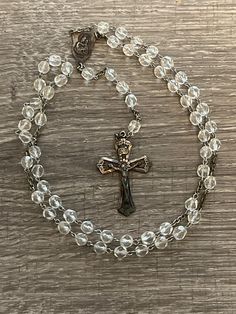 "Vintage Catamore Sterling Silver Crystal Bead Rosary. It is marked \"Catamore\" and \"Sterling\". The cross measures 1 3/8 by 2 inches. This is a beautiful rosary that would make an excellent gift or additional to your own collection. In very good condition; does have some tarnishing due to age on the crucifix/cross." 8mm Bead Crucifix For First Communion, 8mm Bead Crucifix Jewelry For First Communion, Spiritual Cross Rosary With Faceted Beads, Rosary With Faceted Beads And Crucifix, Beaded Cross Rosary For First Communion, First Communion Spiritual Rosary With Crucifix, Spiritual Rosary With Crucifix For First Communion, Spiritual Crucifix Rosary For First Communion, Beautiful Rosary