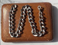 Metal is 750 silver (lower silver content) marked Length of chain: 10.25 Width of chain: 9.61mm Height of swivel clasp: 0.72 inch screws opens and closed well, swivels Total length of the chain: 10.92 inch  Weight: 22.75 grams Clasp works well, works great as a charm holder, and screws down to open. Antique Jewelry With Oval Link Curb Chain, Silver Metal Curb Chain Bracelet, Formal Sterling Silver Link Bracelet With Chain Detail, Formal Sterling Silver Link Bracelet, Silver Link Chain Bracelet With Lobster Clasp, Classic Engraved Chain Link Bracelet, Vintage Sterling Silver Clasp Chain Bracelet Gift, Vintage Chain Bracelet With Sterling Silver Clasp As Gift, Silver Sterling Silver Curb Chain Bracelet