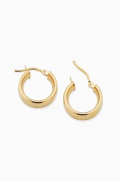 The One Hoops are easy to love. With a sleek design, these hoops will add polished shine to any ear stack or stand out solo as your go-to earrings. Metal: 14k Yellow Gold Dimensions: 6mm Tube, 10mm Inner Diameter Weight: 1.6 Grams Origin: Crafted in Arezzo, Italy Classic Oval Huggie Earrings With Polished Finish, Classic 14k Gold Huggie Earrings, Classic Polished Earrings For Everyday Luxury, Classic Tarnish Resistant Hoop Earrings, Classic 14k Gold Hoop Earrings, Classic Polished Everyday Luxury Earrings, Classic Earrings With Shiny Finish, Classic Small Hoop Huggie Earrings With Polished Finish, Classic 14k Gold Hoop Earrings With Shiny Finish