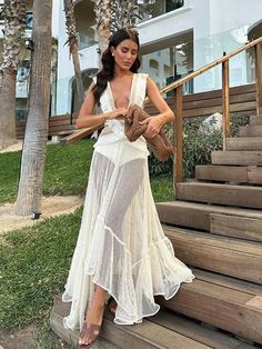 Experience effortless elegance in the Fringe and Mesh Cutout Maxi Dress. Featuring a deep V-neckline, irregular ruffled details, and a sleeveless design, this dress exudes modern sophistication. The hollow out and tassel accents add a touch of playful flair, making it the perfect choice for any fashion-forward woman. Party V-neck Maxi Dress With Ruffled Skirt, Elegant V-neck Maxi Dress With Ruffled Skirt, Summer V-neck Maxi Dress For Cocktail, V-neck Midi Dress For Beach Party, Ruffled Maxi Length V-neck Dress For Party, Ruffled Maxi V-neck Dress For Party, Maxi Length V-neck Ruffle Dress For Party, Chic Asymmetrical Summer Wedding Dress, V-neck Cocktail Dress With Ruffled Skirt