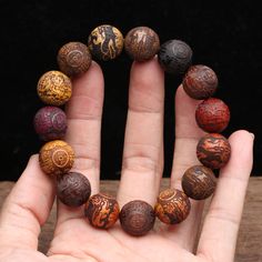 Choose from a variety of different woods for your Lucky Pixiu Good Karma Bracelet  These wooden beads are engraved with the mythical beast, the PIXIU, from natural, unstained wood. The Pixiu symbolizes good fortune, and protection.    These bracelets are made up in a variety of different woods including ebony, white wood, violet wood, golden wood,wenge wood, nanmu wood, Zambian rosewood and gold silk wood.     Or if you prefer, you can have a mixture of different wood beads in one bracelet.   Choose from either 15mm beads (total of 15 beads/bracelet) for women or 20 mm ( total of 12 beads/bracelet ), more suited for men.    Want to know more about the Feng Shui Pixiu?     The Pi Xiu is a legendary auspicious creature and is known for wealth attraction and is one of the five auspicious anim Inner Energy, Karma Bracelet, Buddhist Bracelet, Wenge Wood, Mythical Beast, Wooden Bracelet, Gold Silk, Fashion Materials, Hair Beads