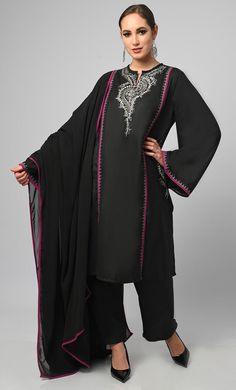 Embroidered black salwar phiran set. It is a detailed and intricate form of contrast piping and zari work embroidered on sleeves, pockets and neck, colorful stitches to create patterns and designs on the fabric of the garment. It is a popular choice for special occasions, such as weddings and festivals. Salwar suits are more modern and casual alternative to the traditional salwar kameez Fabric Details TOP Pure polyster poplin with zari work detailing on neck and sleeves, Full loose sleeves Dupat Black Anarkali Set With Embroidered Border For Diwali, Black Anarkali Kurta With Embroidered Border, Black Anarkali Set With Embroidered Border For Festivals, Bollywood Style Black Palazzo Set For Festive Season, Festive Bollywood Style Black Palazzo Set, Bollywood Style Black Palazzo Set For Festive Occasions, Bollywood Style Black Palazzo Set For Eid, Bollywood Black Palazzo Set For Eid, Black Palazzo Set For Festivals