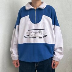 90s Vintage Adidas zip sweater in blue and white colours. Has a ribbed collar and cuffs, a half zipper and a boxy silhouette. Features machine embroidery of a city and `30s` `Chicago` text on the front and `30s` on the back. Such a unique garment, not on sale anywhere else right now!  SIZE  - Size on the label 48  - Shown on size S CONDITION  - Great condition. Has slight stains on the front(see pictures), but no rips.  MEASUREMENTS - in centimetres Pit to pit - 70 cm Sleeve - 57 cm  Length - 57 Retro Sweatshirt With Ribbed Collar For Winter, Blue Retro Winter Sweatshirt, Retro Sweatshirt With Ribbed Collar For Streetwear, Blue Retro Long Sleeve Hoodie, Blue Long Sleeve Retro Hoodie, Retro Blue Sweatshirt For College, Retro Blue College Sweatshirt, Blue Retro Sweatshirt For College, Vintage Sweatshirt With Ribbed Collar For Streetwear