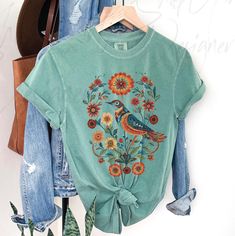 Folk Art shirt, Boho Cottagecore Shirt, Comfort Colors ® tshirt, Naturecore shirt,  folk art flower shirt, nature lover, scandi art shirt, nature lover gift, boho hippie shirt, Comfort Colors tee, 100 percent cotton shirt, scandinavian art shirt This Comfort Colors T shirt  - is printed professionally DTG which is ink actually printed into the garment for a soft finish and long lasting design. Made with 100% ring-spun cotton, these t shirts come packed with softness and style. Each tee features Vintage Hand-printed Relaxed Fit Top, Vintage Hand Printed Cotton Top, Green Bohemian Top With Graphic Print, Bohemian Cotton Top, Bohemian Cotton Top With Relaxed Fit, Green Bohemian Printed Shirt, Bohemian Spring Top With Motif, Bohemian Tops With Motif For Spring, Bohemian Green Printed Shirt