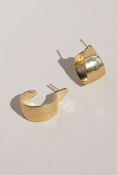 Sleek and sophisticated, classic and timeless, these hoop oval earrings are perfect for day or night. The hammered texture catches the light and the simple style adds a bold pop. Gold Vermeil (14k gold over sterling silver) made with recycled materials. CARE: Most metals will naturally patina over time, however, there are measures you can take to prolong the life of your jewelry. We recommend removing all jewelry prior to showering, swimming, cleaning, or applying lotions or oils. If your jewelr Modern Gold Hammered Hoop Earrings, Modern 14k Gold Hammered Hoop Earrings, Gold Hammered Oval Hoop Earrings, Gold Oval Hammered Hoop Earrings, Gold Hammered Hoop Earrings, Hammered Hoop Earrings, Oval Earrings, Oval Earring, Ceramic Studio